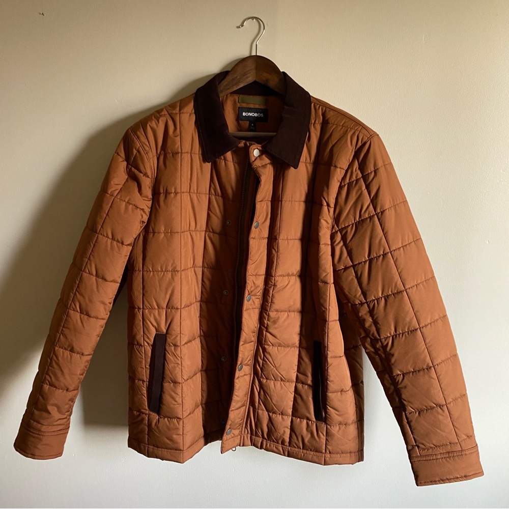 Quilted barn jacket in chestnut brown (orange-like). Size M. As good as new!